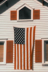 American Flag Hanging on a House